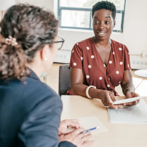 two senior school leaders talking